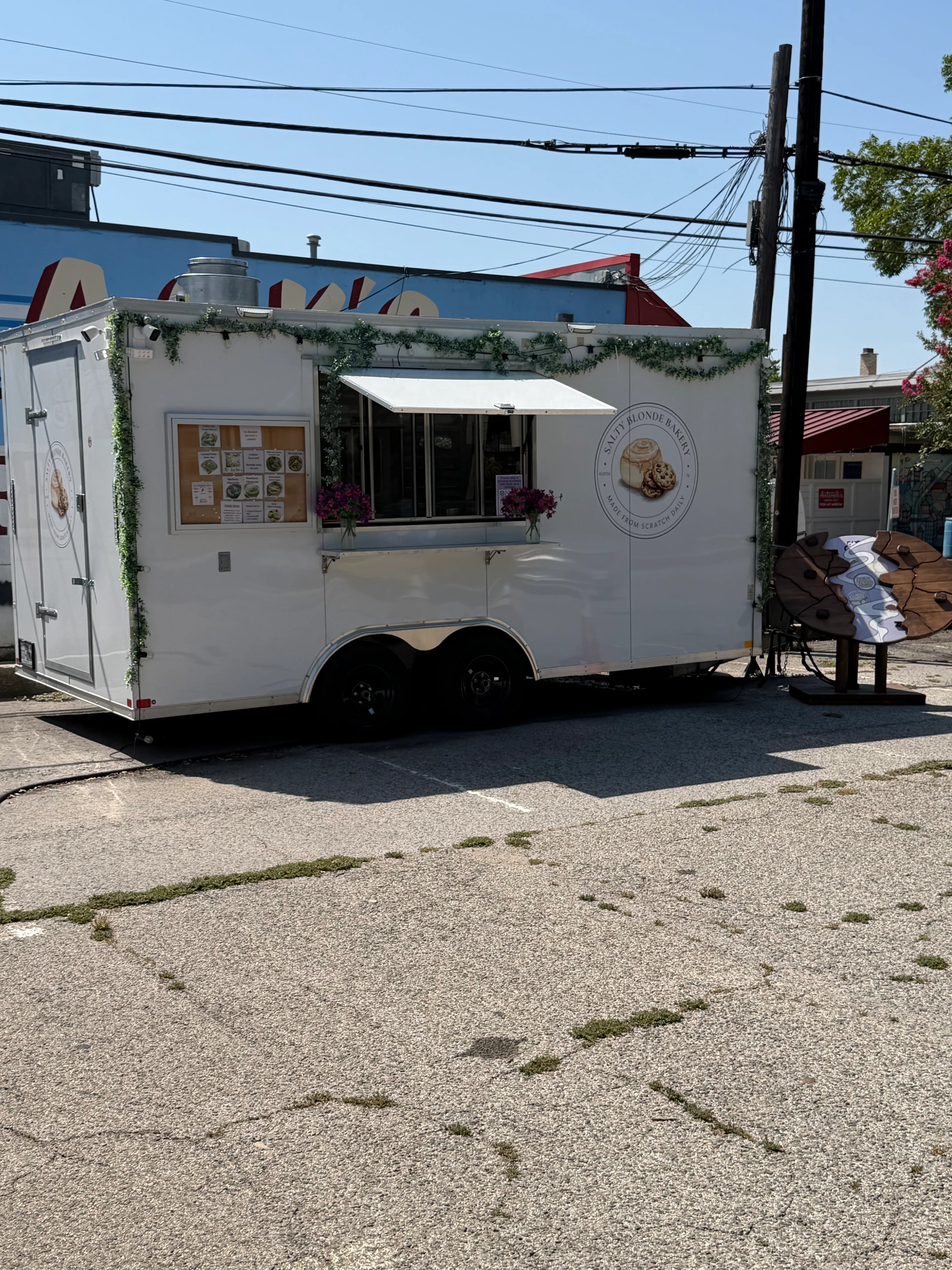 Salty Blonde Bakery trailer and outdoor service area in Austin.